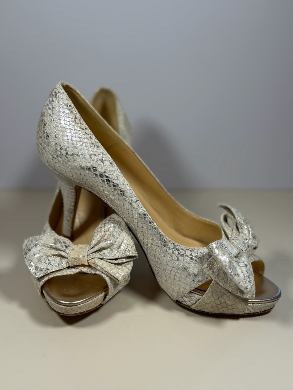 kate spade Silver Snake-Embossed Peep Toe Heels with Bow